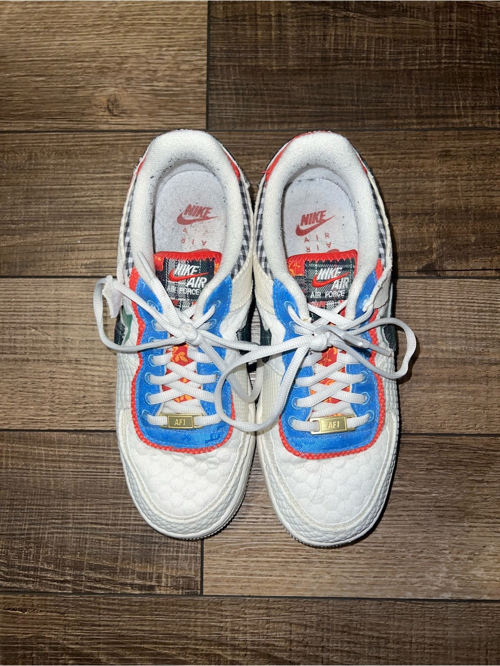 Nike White Sneakers with Blue and Red Accents